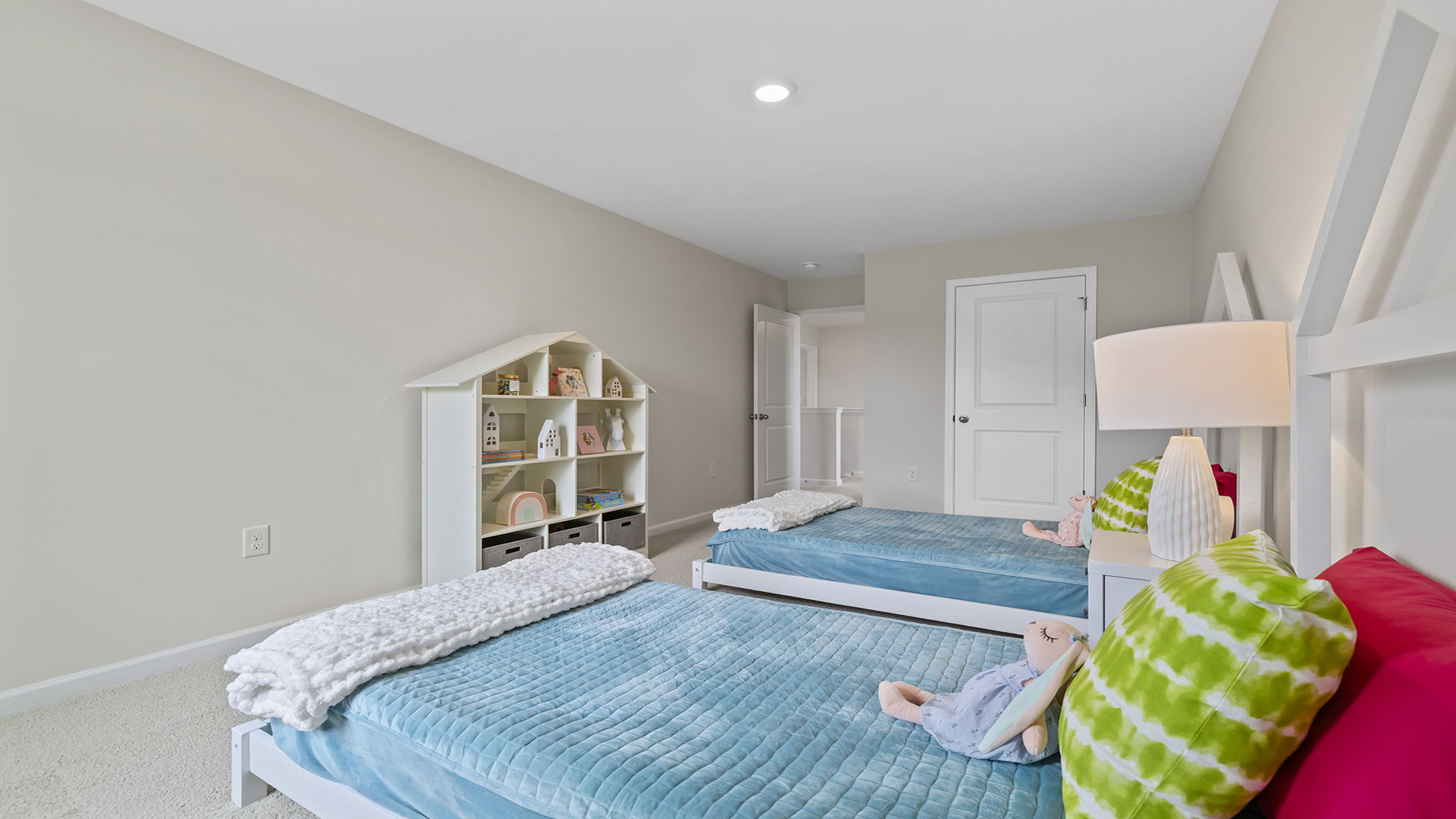 Bedroom with carpet and window.