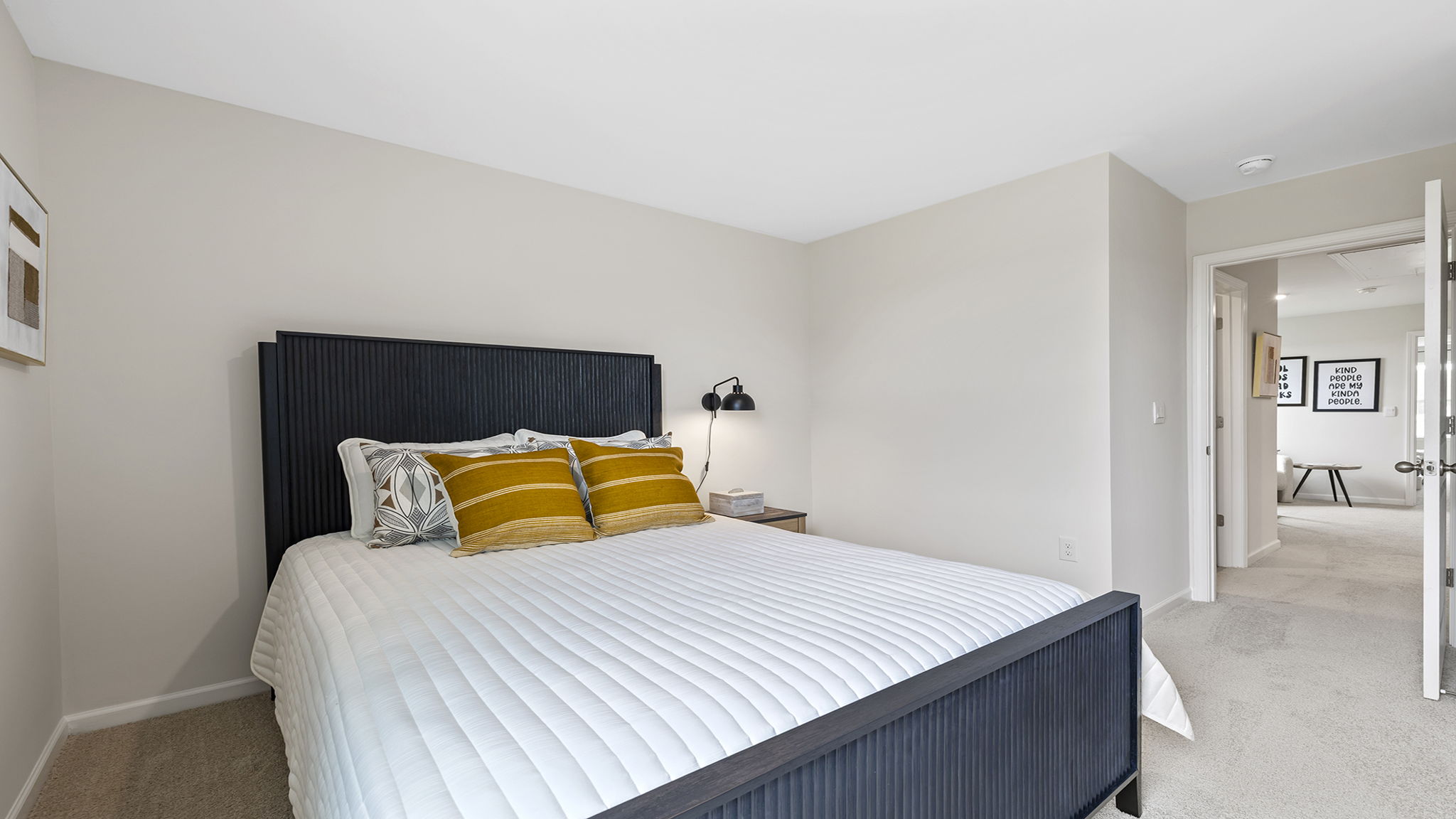 Bedroom with carpet and window.