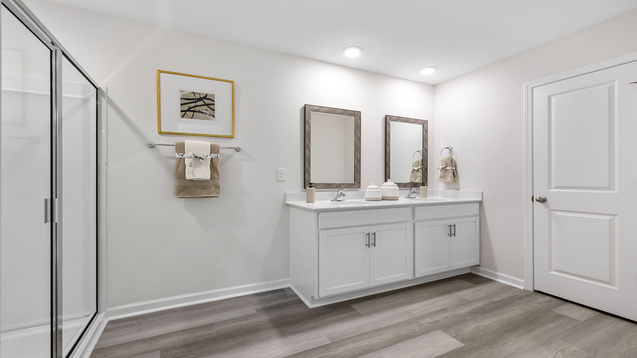 Primary bathroom with double vanity sinks.