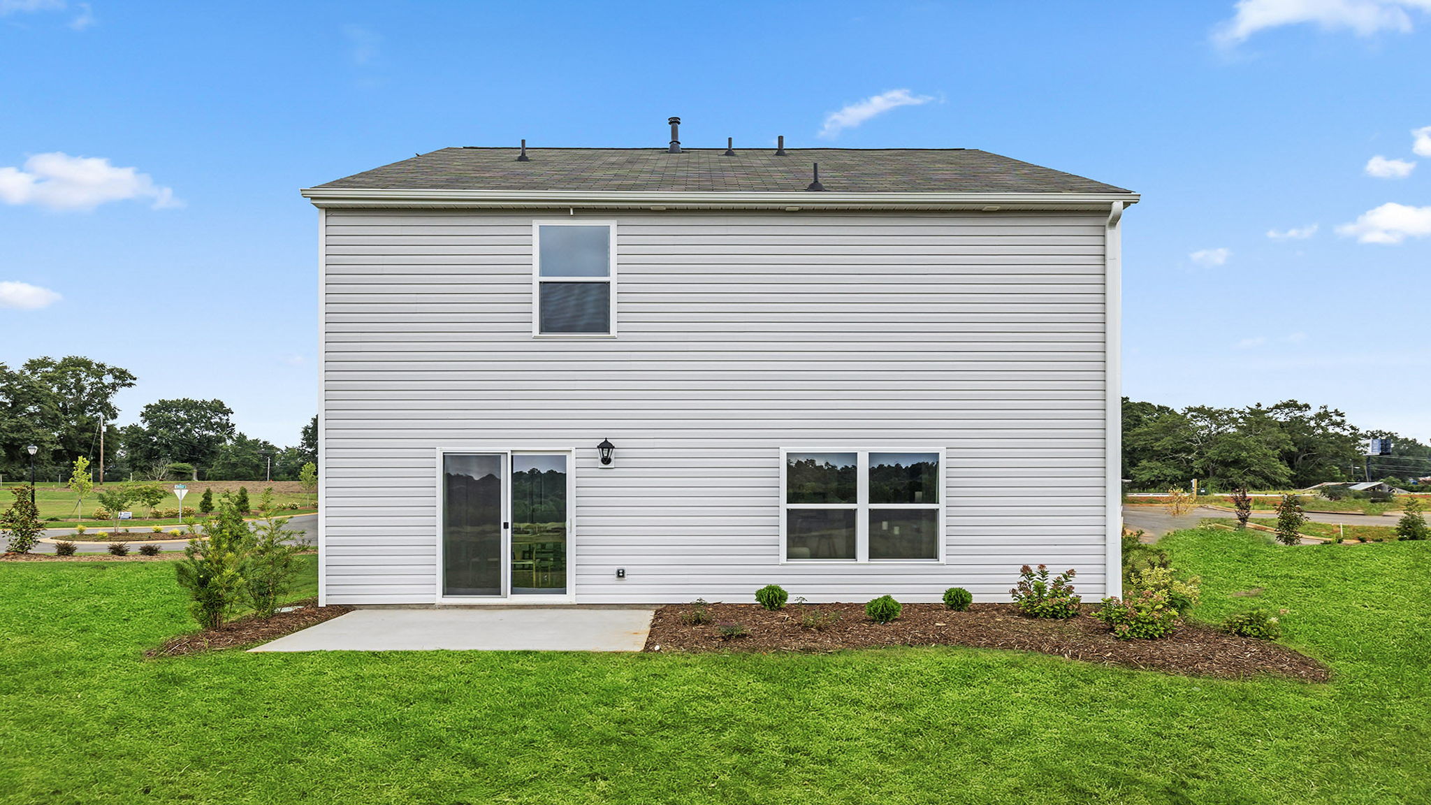 Back exterior with large backyard.