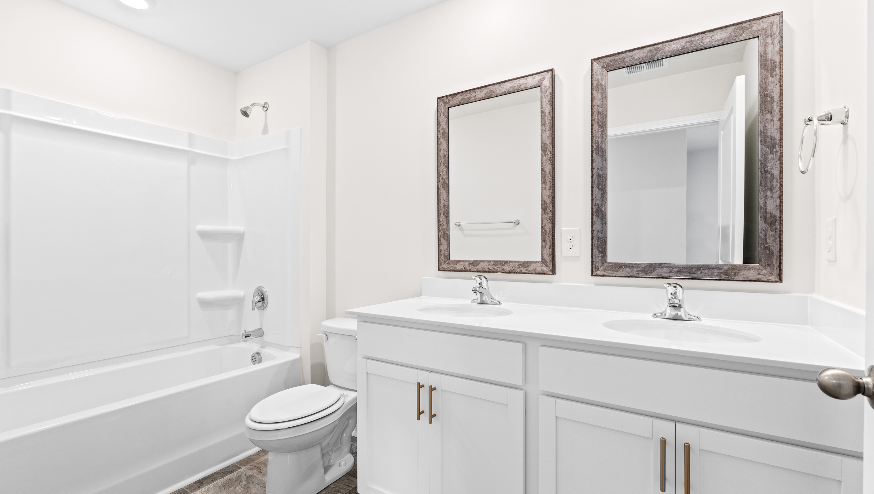 Double sink vanity with tub.