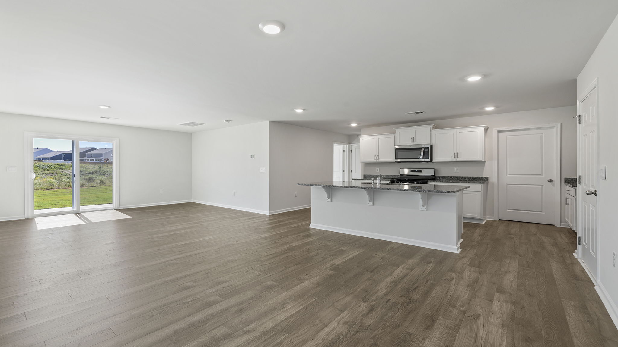 Kitchen open to the combination living and dining areas.