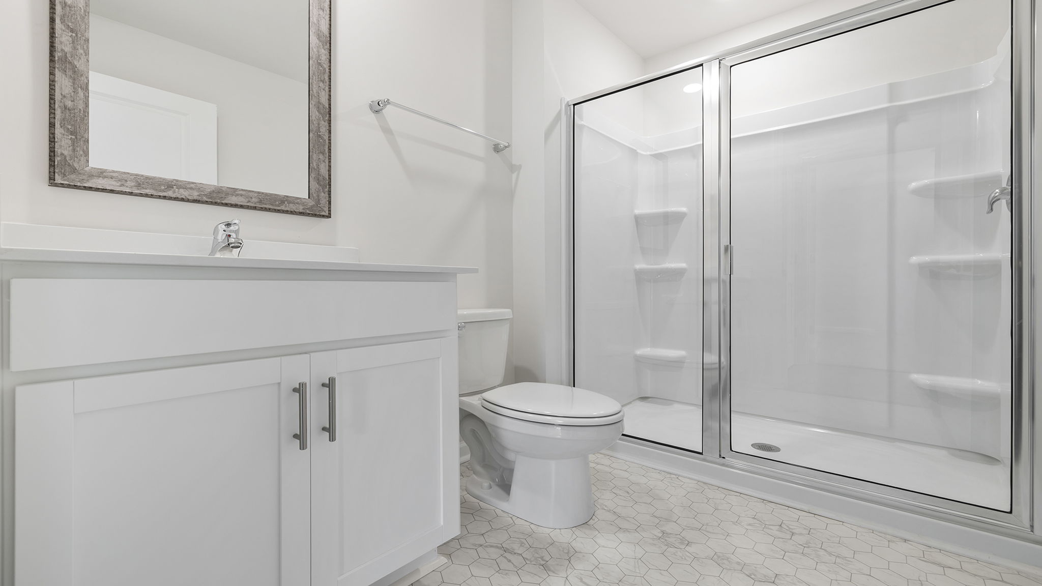 Hall bathroom with vanity and combination shower / tub.
