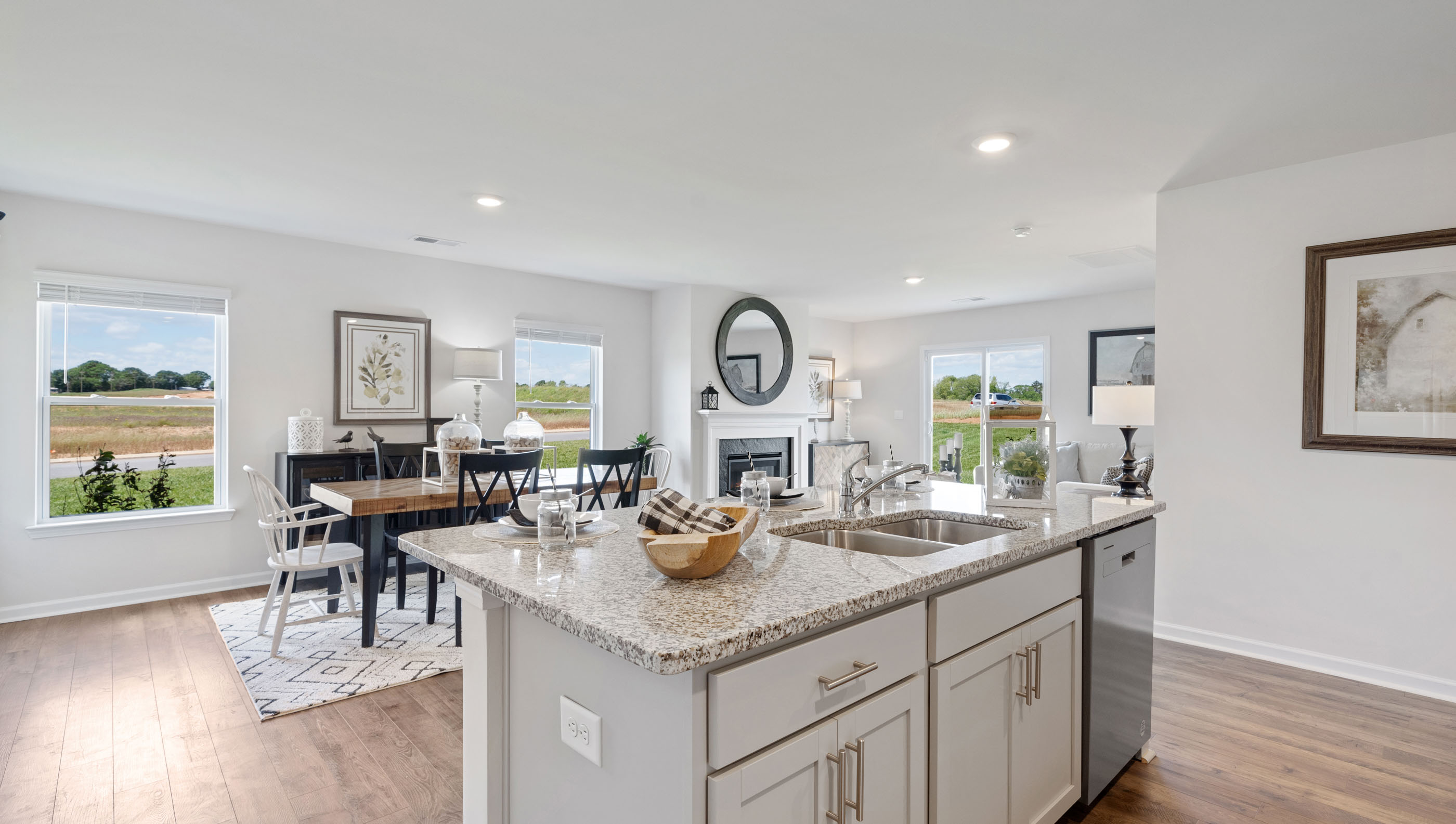 Kitchen and island with granite counter tops.