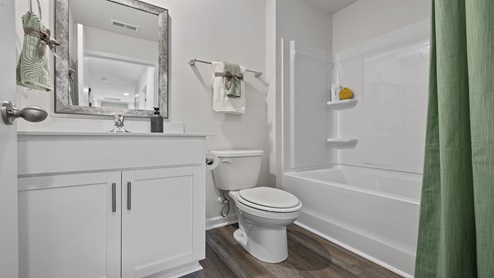 Bathroom with vanity sink and shower.