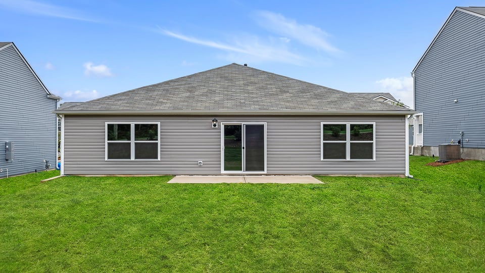 Back exterior with large backyard.