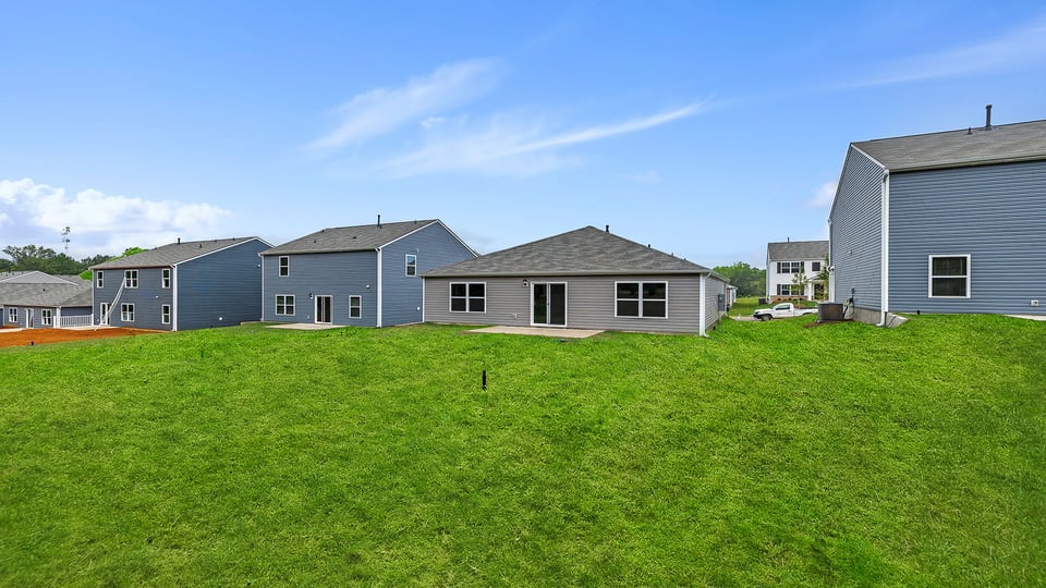 Back exterior with large backyard.
