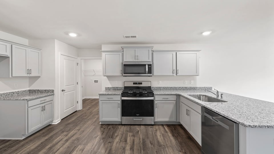 Kitchen with stainless steel appliances.