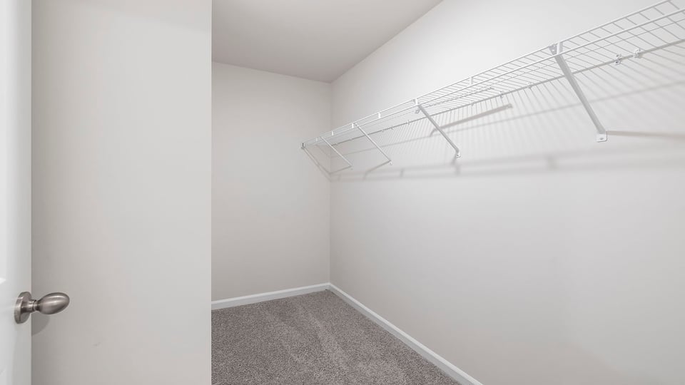 Closet with hanging storage racks.