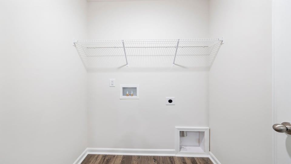 Laundry room with hanging storage racks.