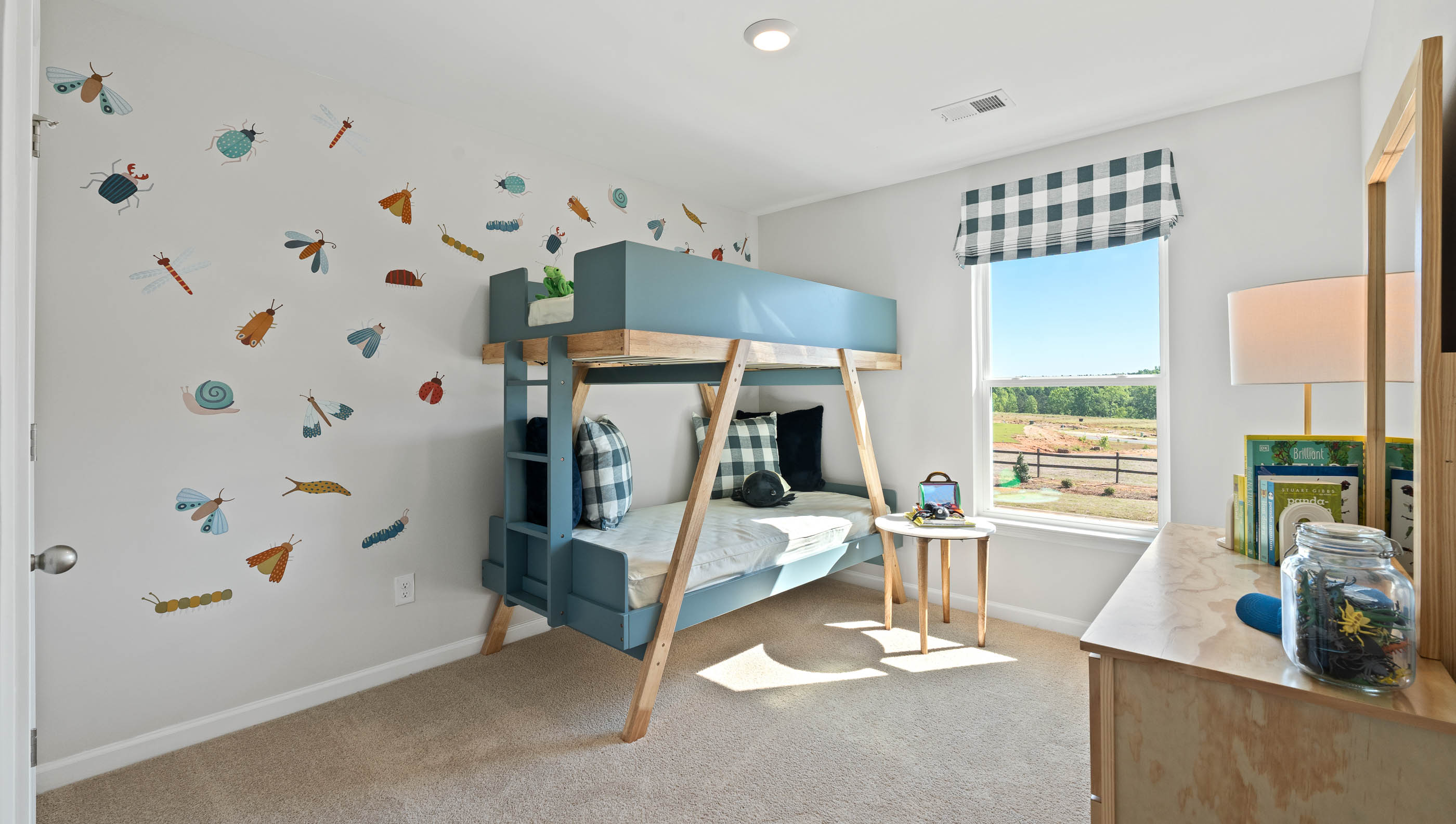 Bedroom with carpet and windows.