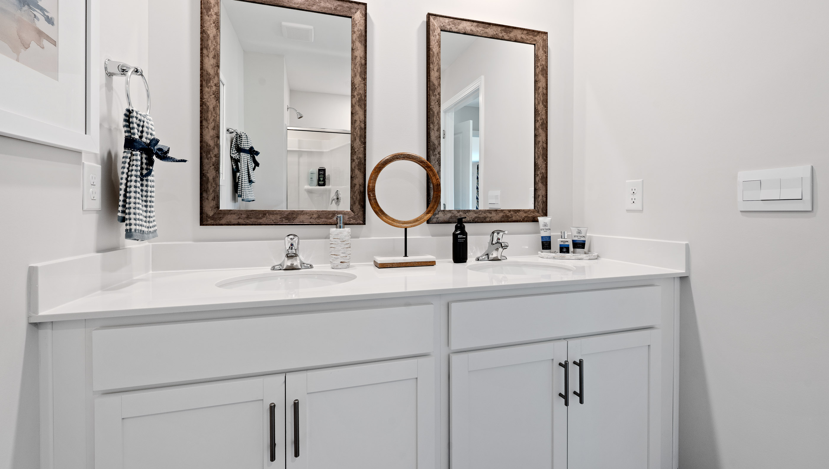 Primary bathroom with double vanity sinks.