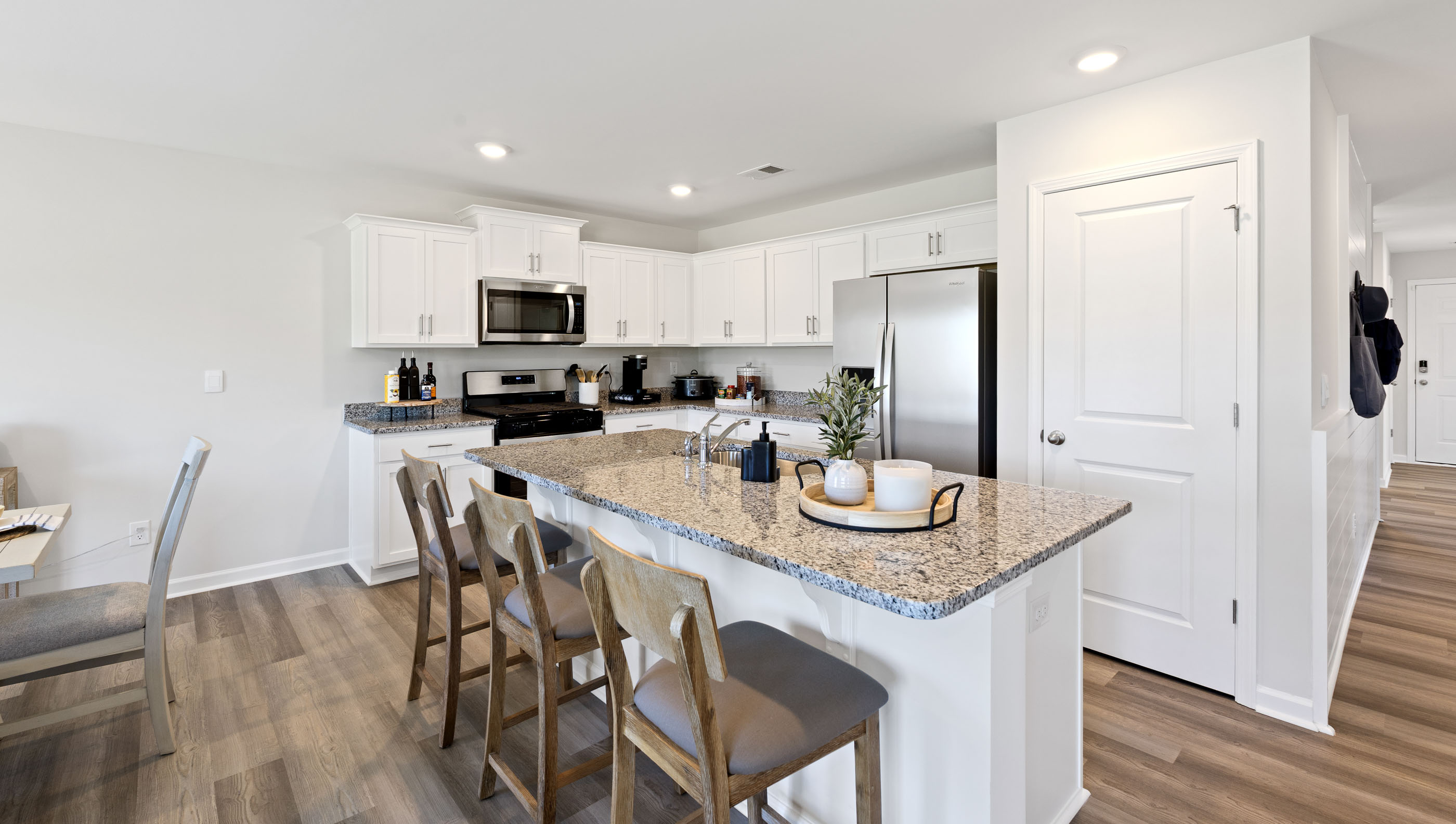 Kitchen with island and cabinets.