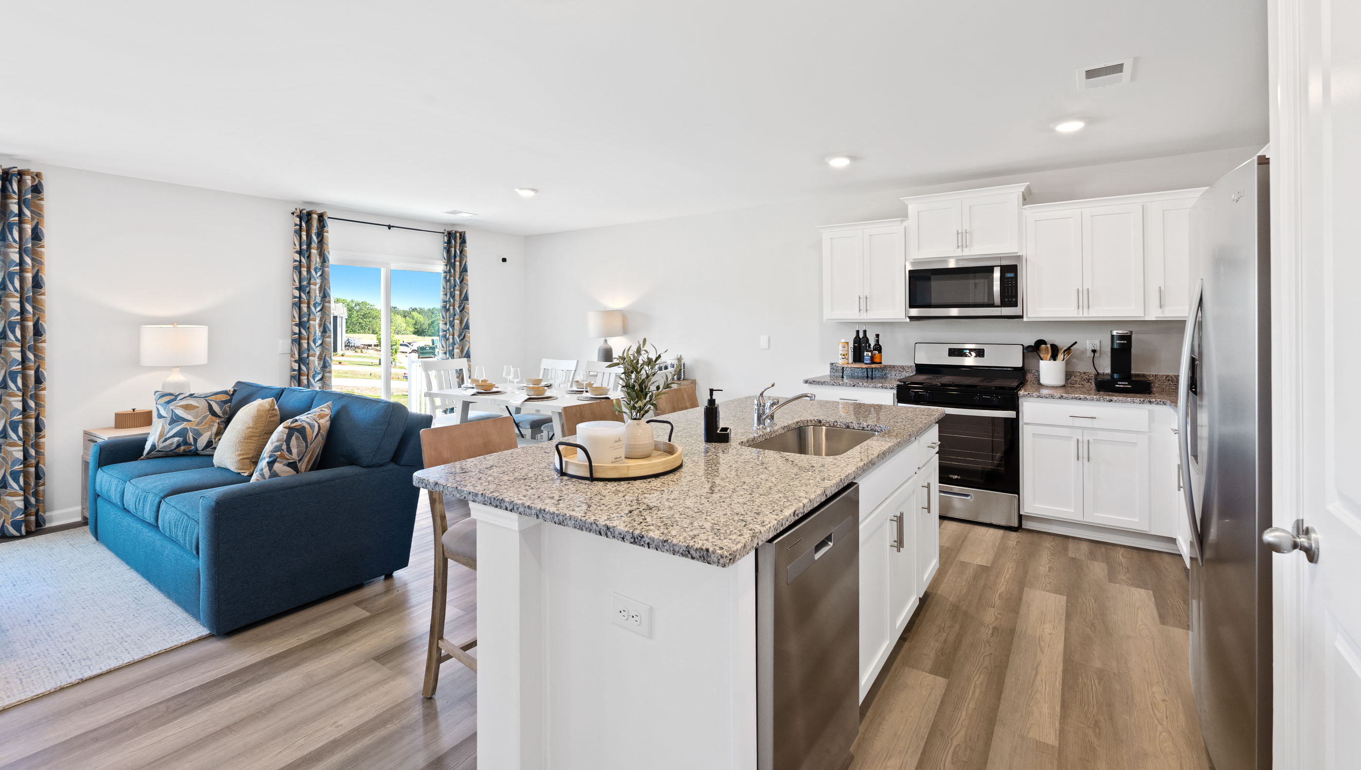 Kitchen with island and cabinets.