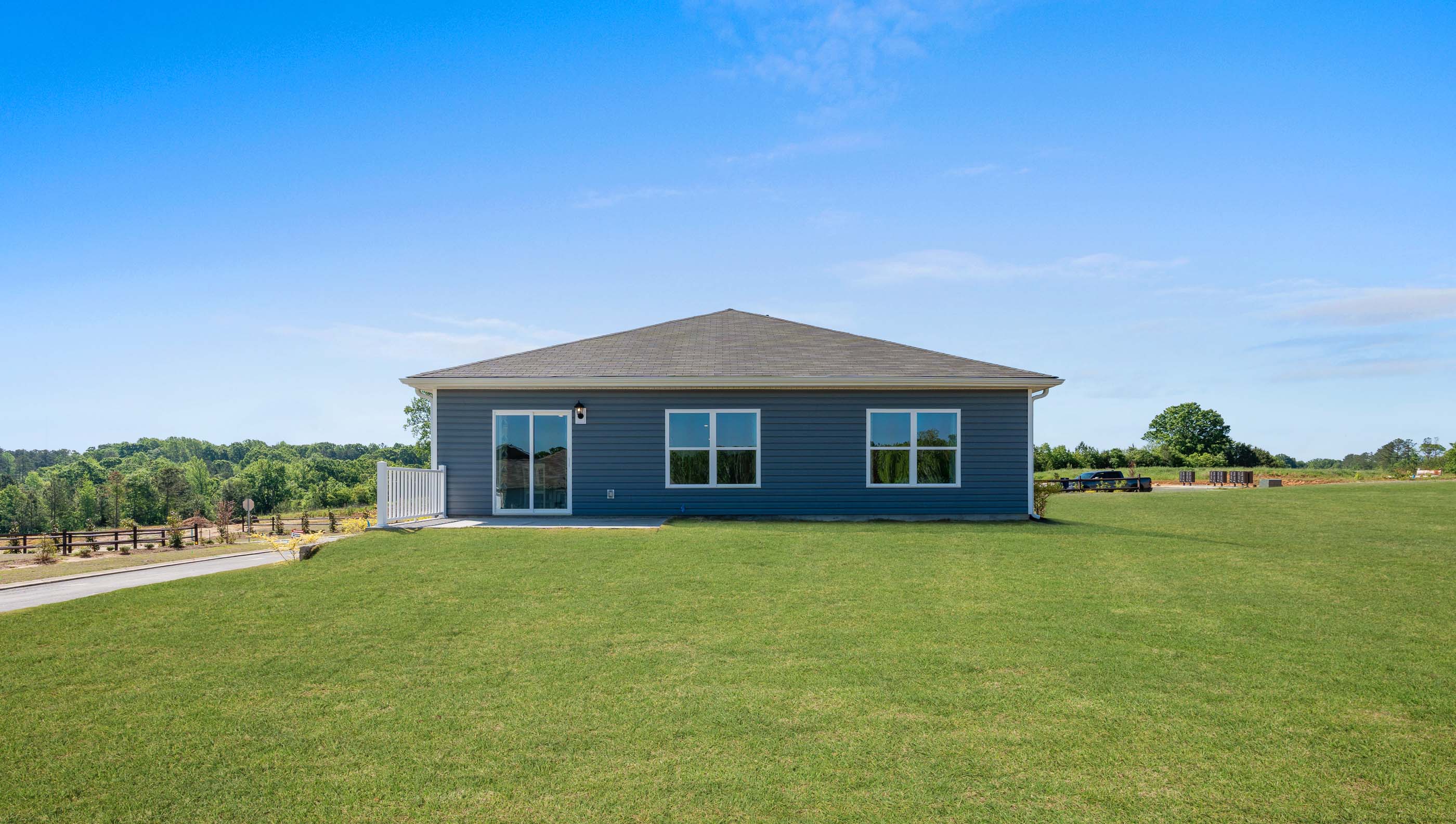 Back exterior with large backyard.