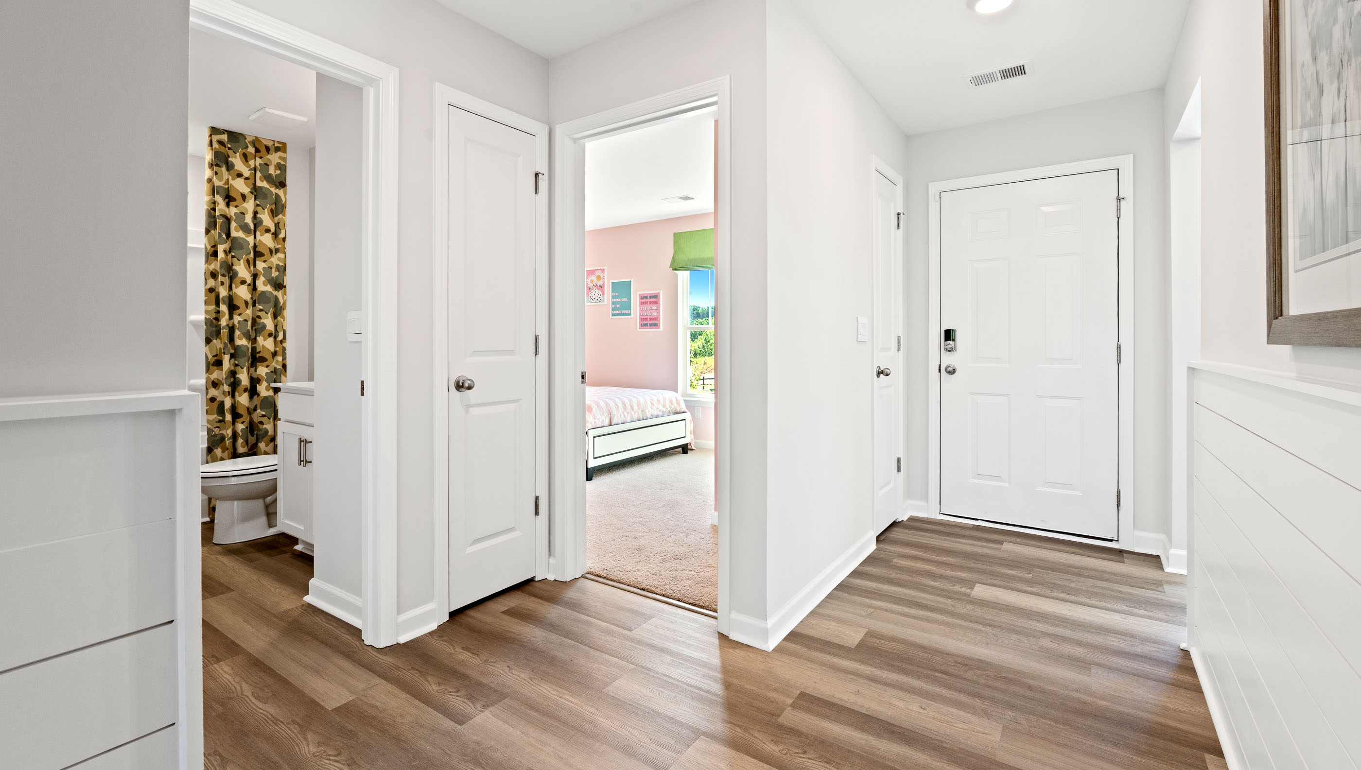 Hallway to bedrooms and kitchen.