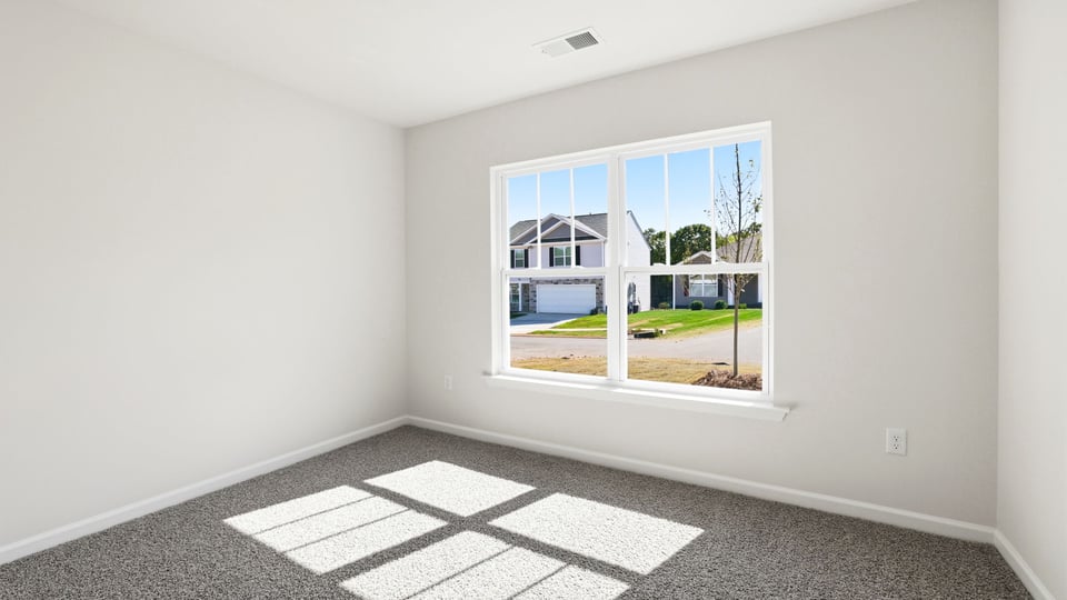 Bedroom with carpet.