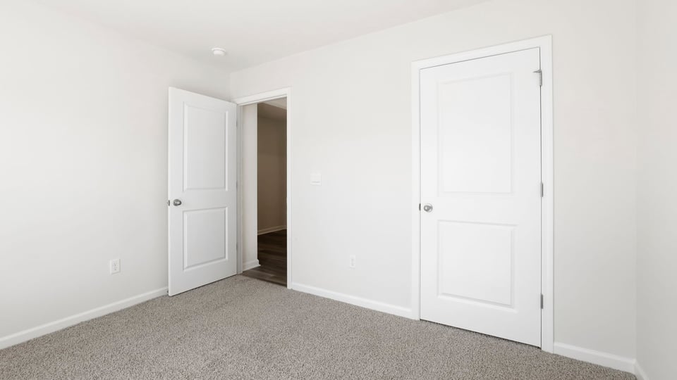 Bedroom with carpet.