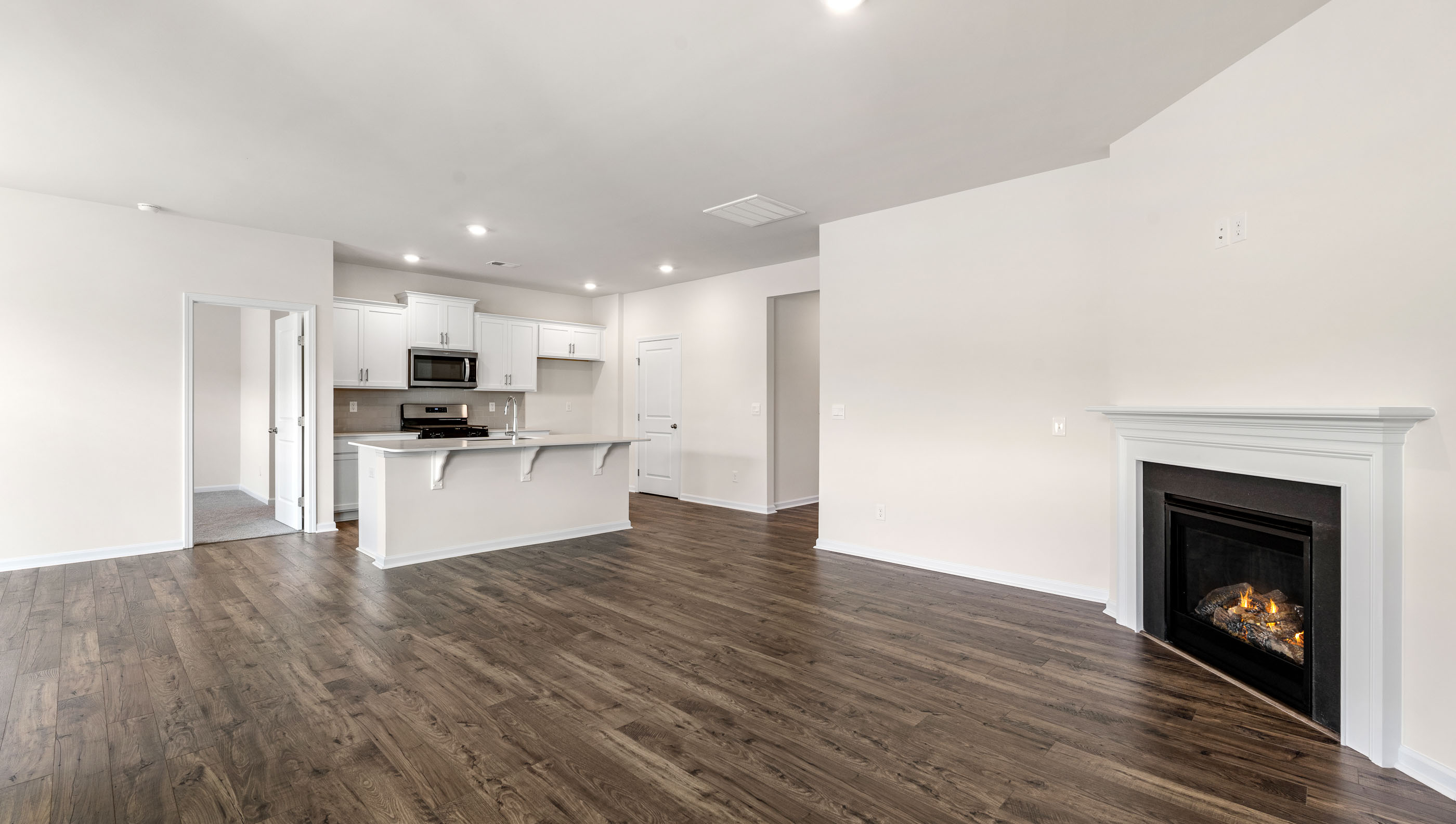 Family room with fireplace and window.