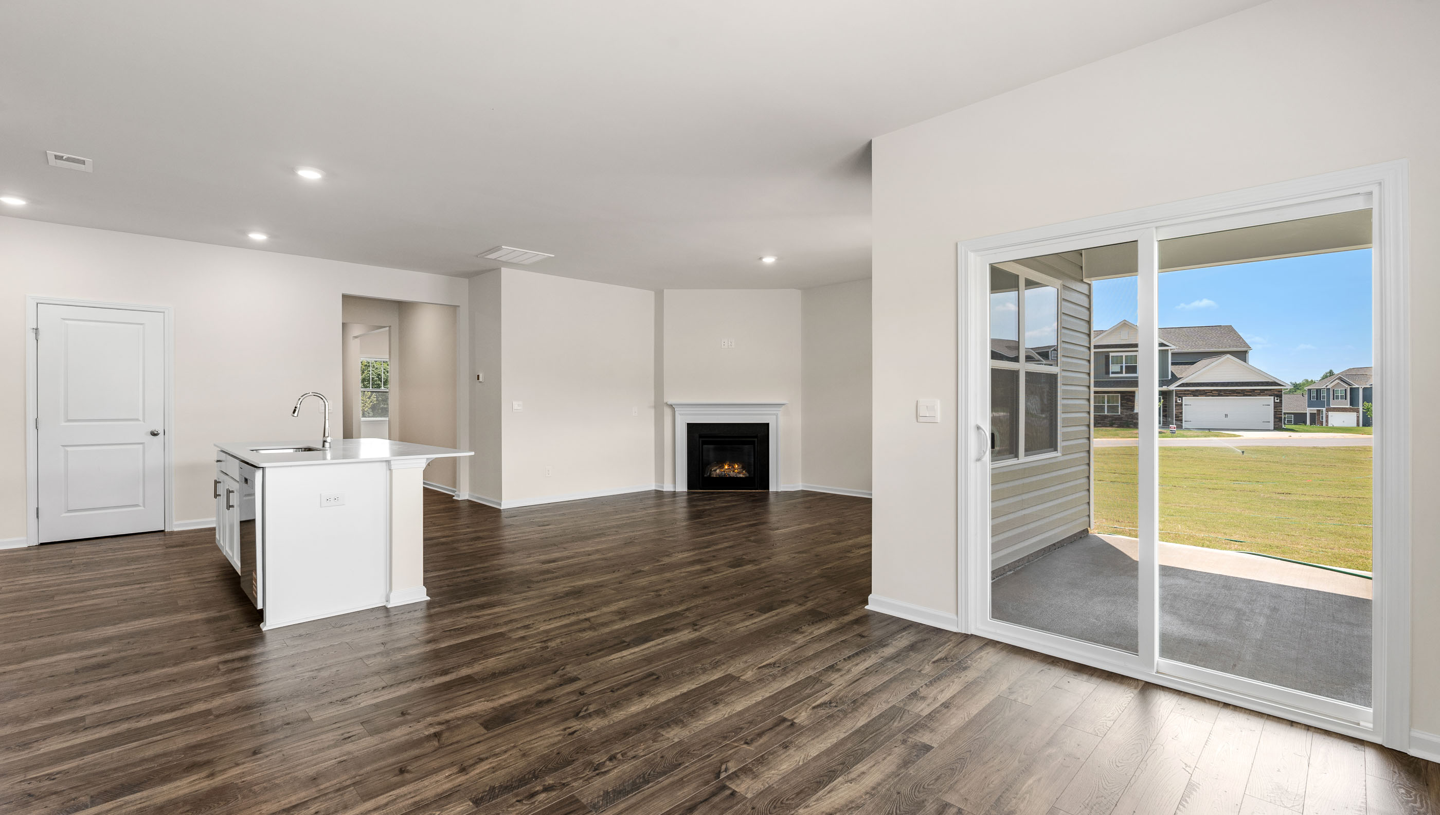 Family room with fireplace and window.