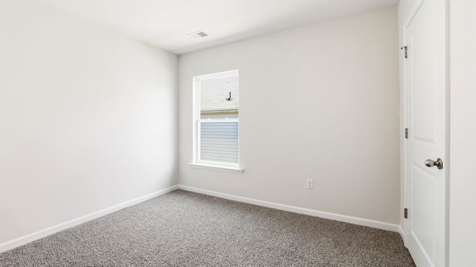 Bedroom with carpet.