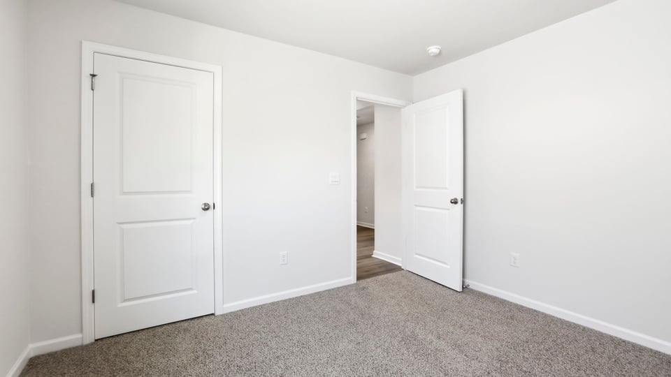 Bedroom with carpet.