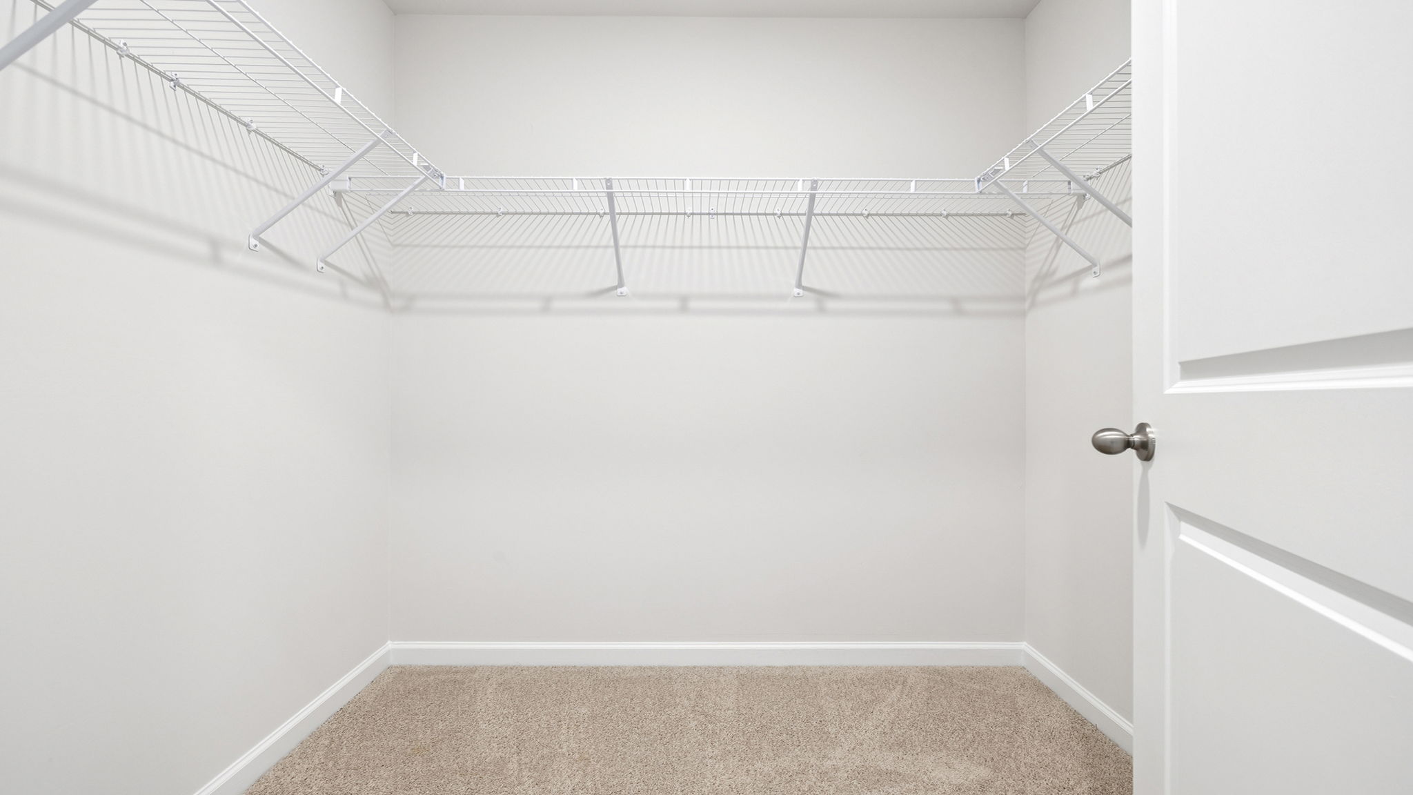 Primary bedroom walk-in closet.