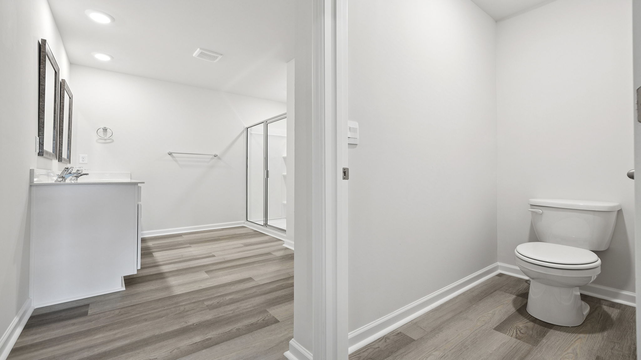 View of toilet area in primary bathroom.