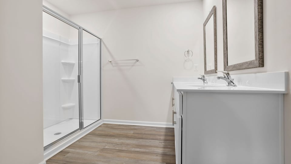 Primary bathroom with double vanity sinks.