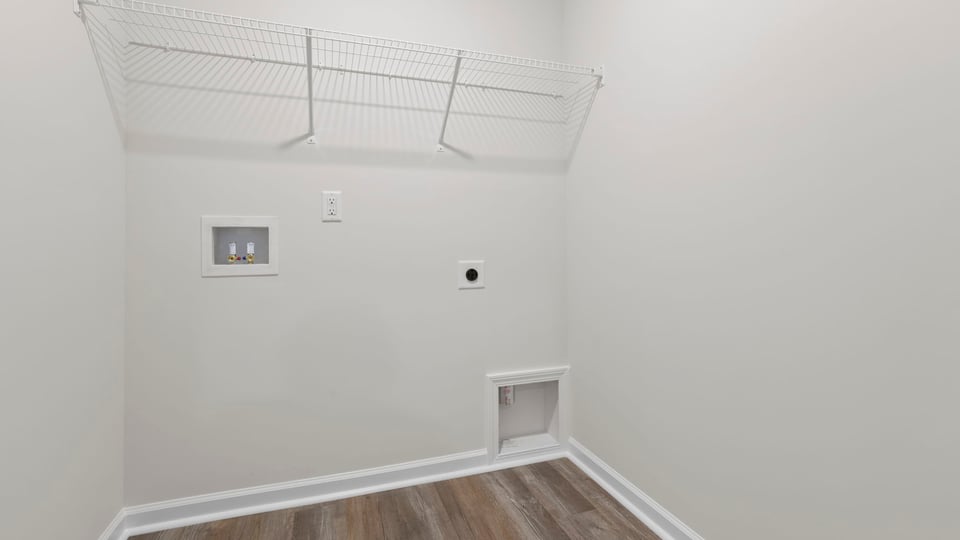 Laundry room with shelf.