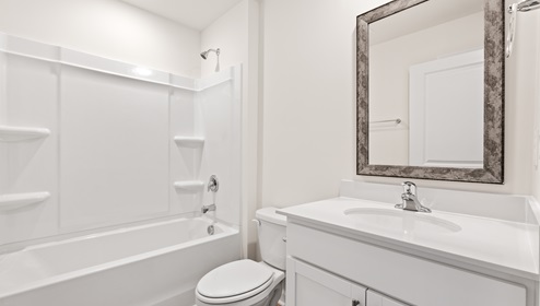 Bathroom with toilet and tub.