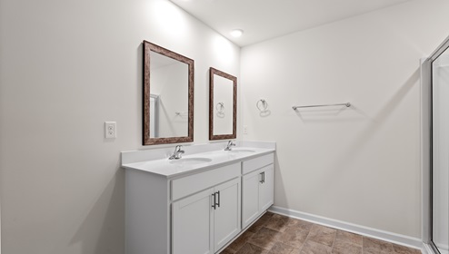 Bathroom with shower and double vanity.