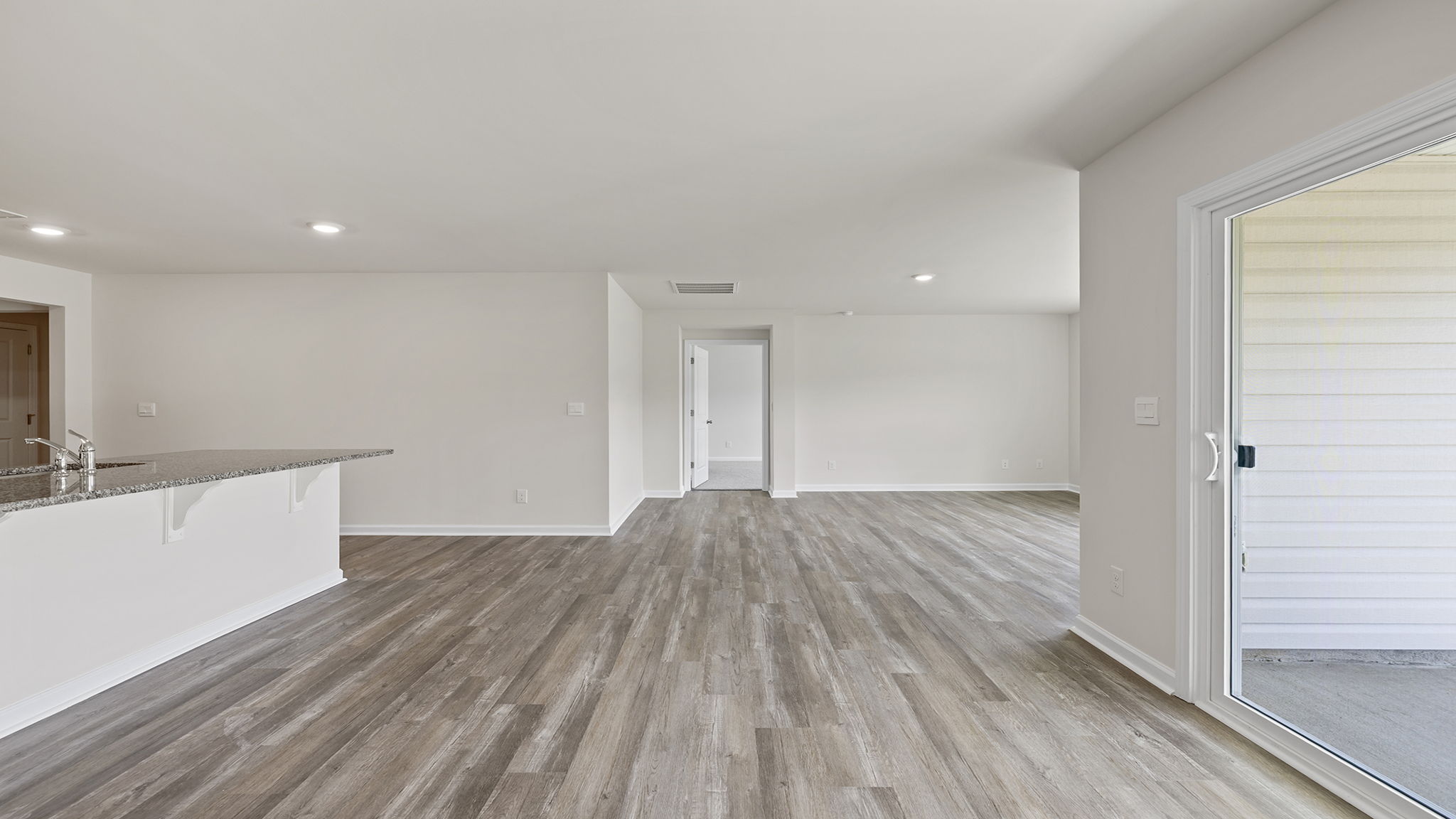 View of combination living and dining areas.