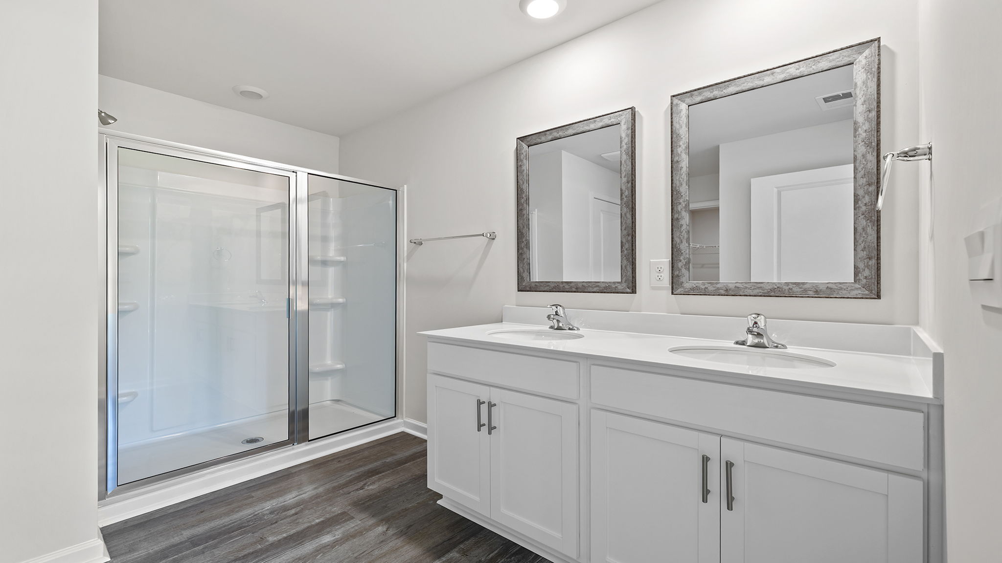 Primary bathroom with dual sink vanity.