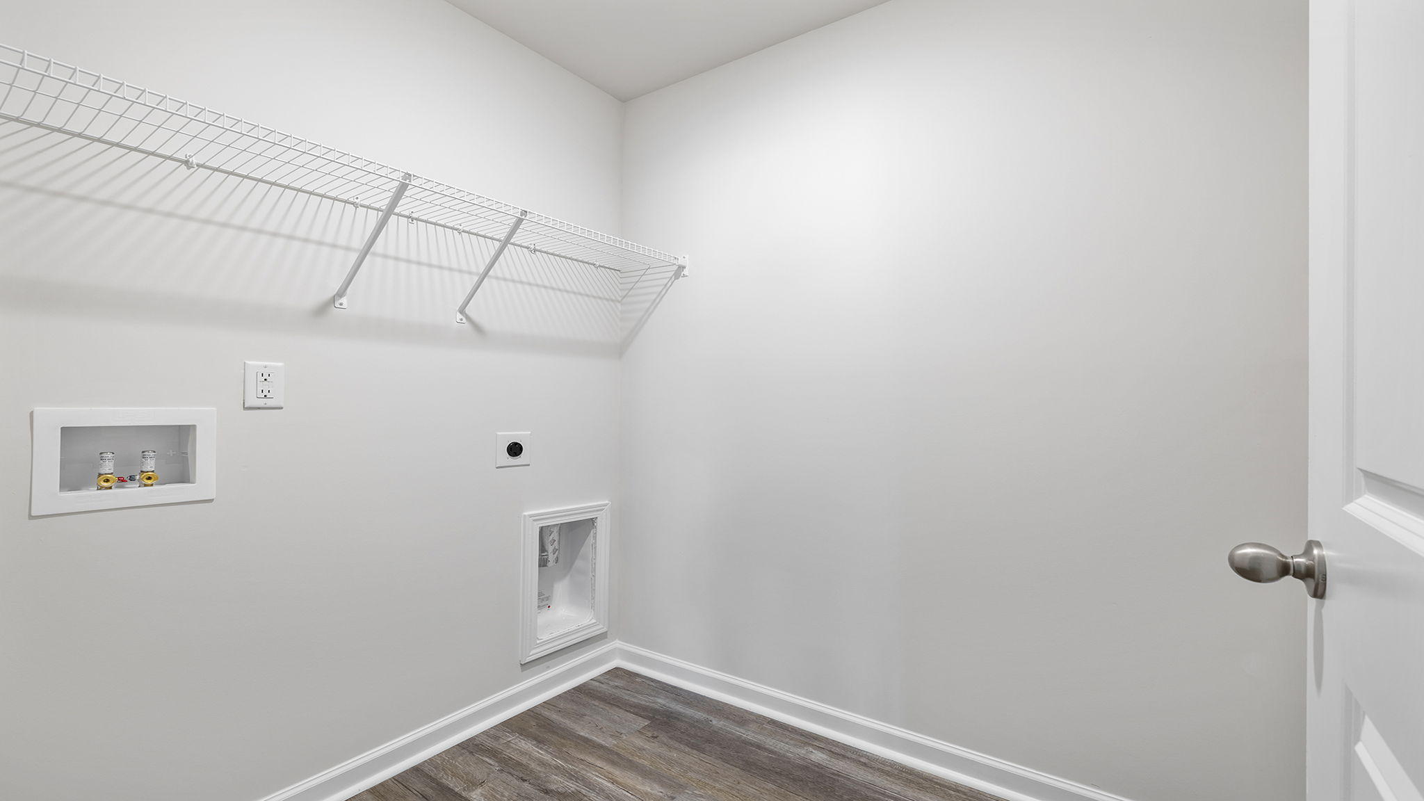 Laundry room with shelving.