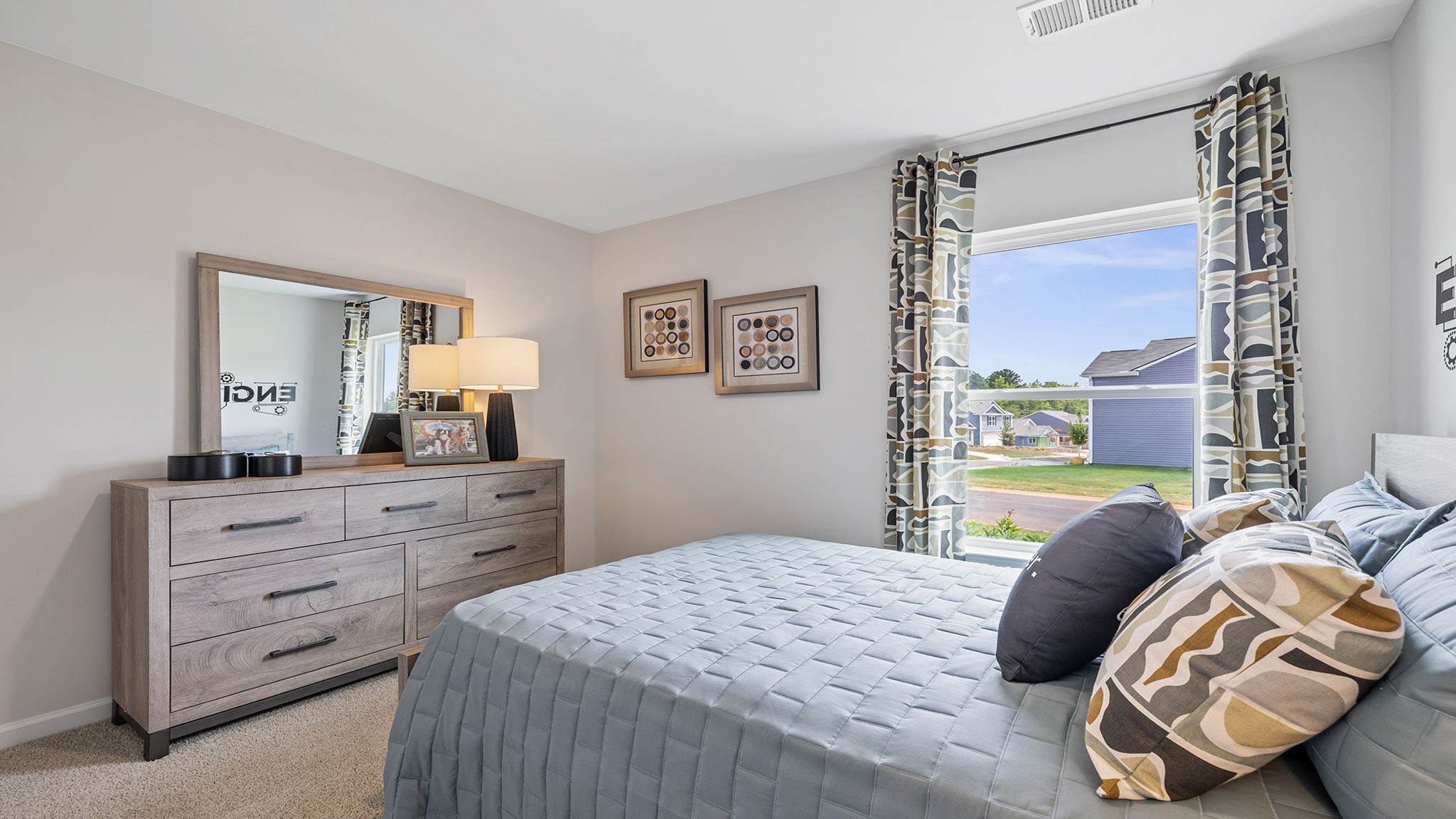 Bedroom with carpet and windows.