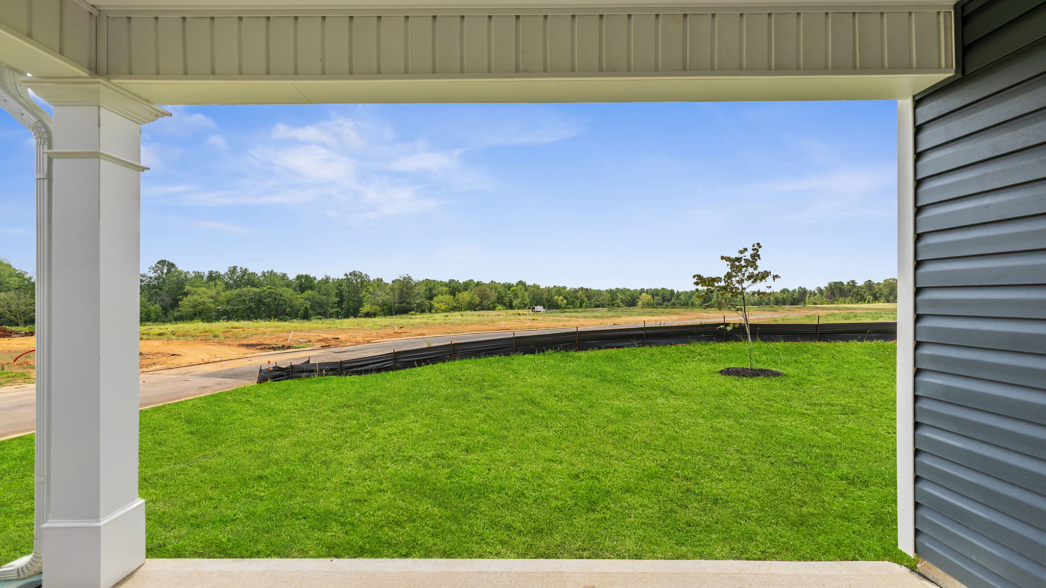 Back exterior with large backyard.