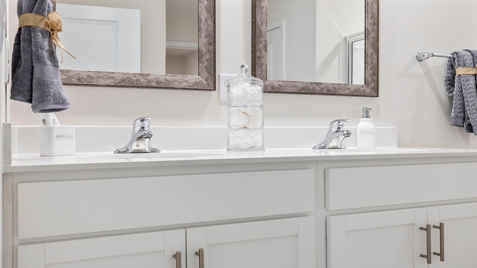 Primary bathroom with double vanity sinks.