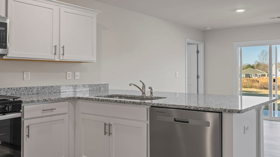 Kitchen with stainless steel appliances.