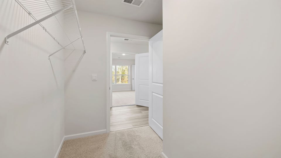 Closet with hanging storage racks.