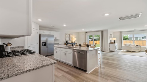 Kitchen and island with granite counter tops.