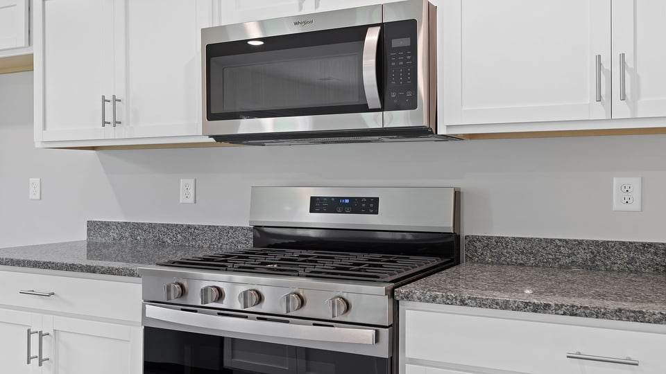Kitchen with island and cabinets.