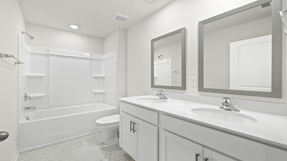 Bathroom with double vanity sinks.