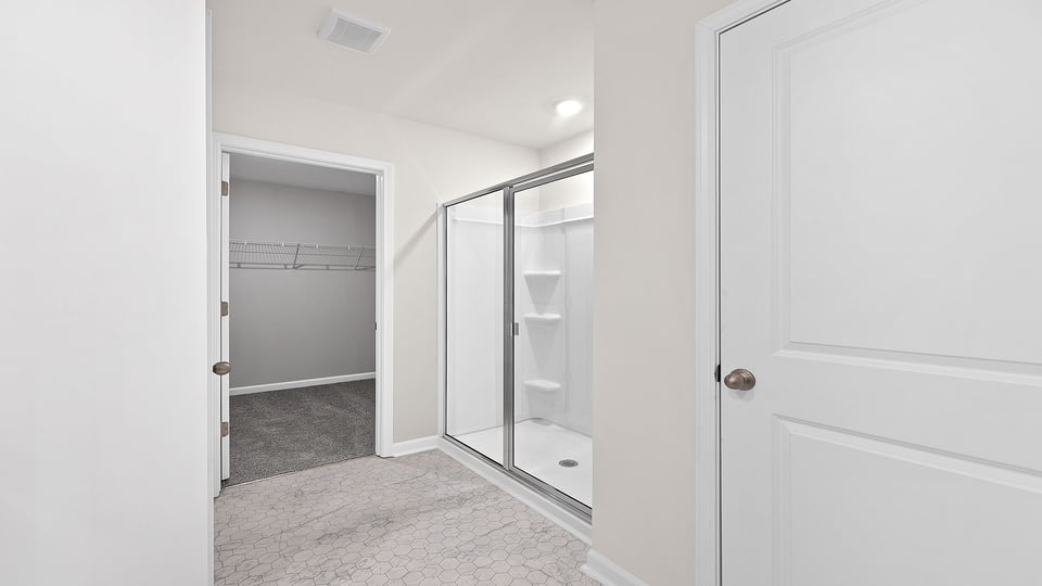Primary bathroom with double vanity sinks.