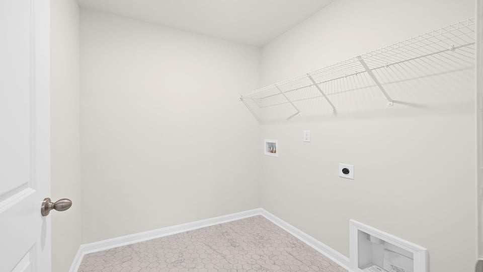 Laundry room with shelf.