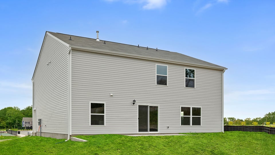 Back exterior with large backyard.