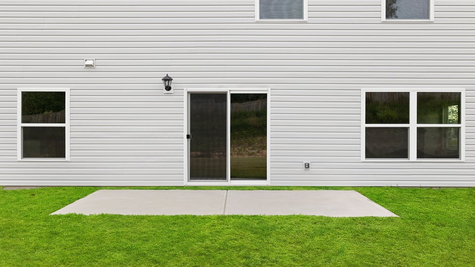 Back exterior with large backyard.