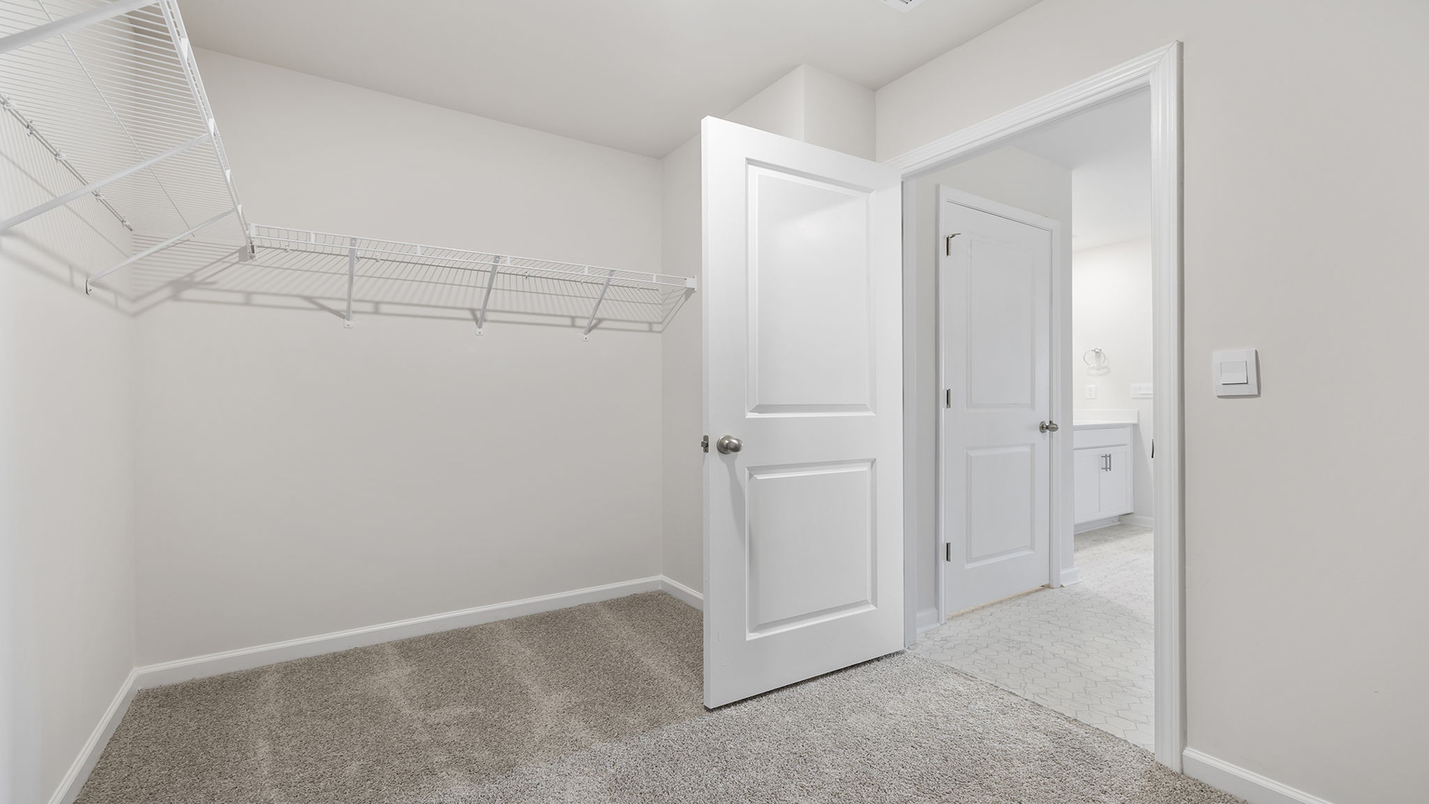 Primary bedroom walk-in closet.