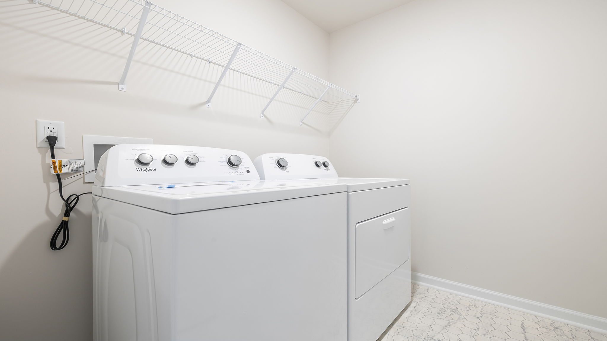 Laundry room with shelving.