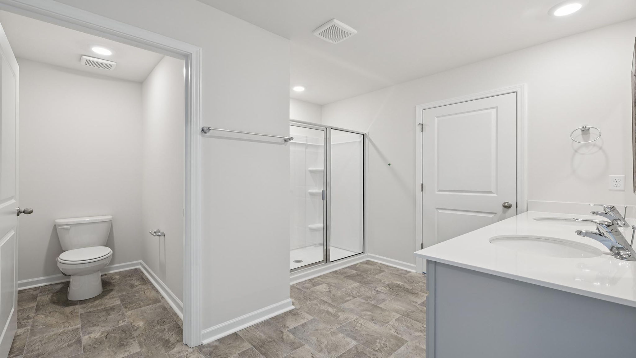 Primary bathroom with walk-in shower.
